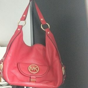 Michael Kors red leather shoulder bag.